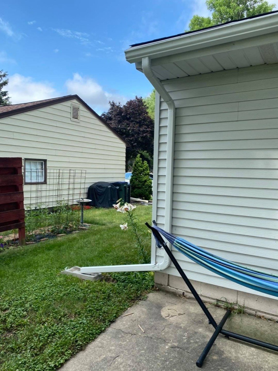 Downspout connection painted to match