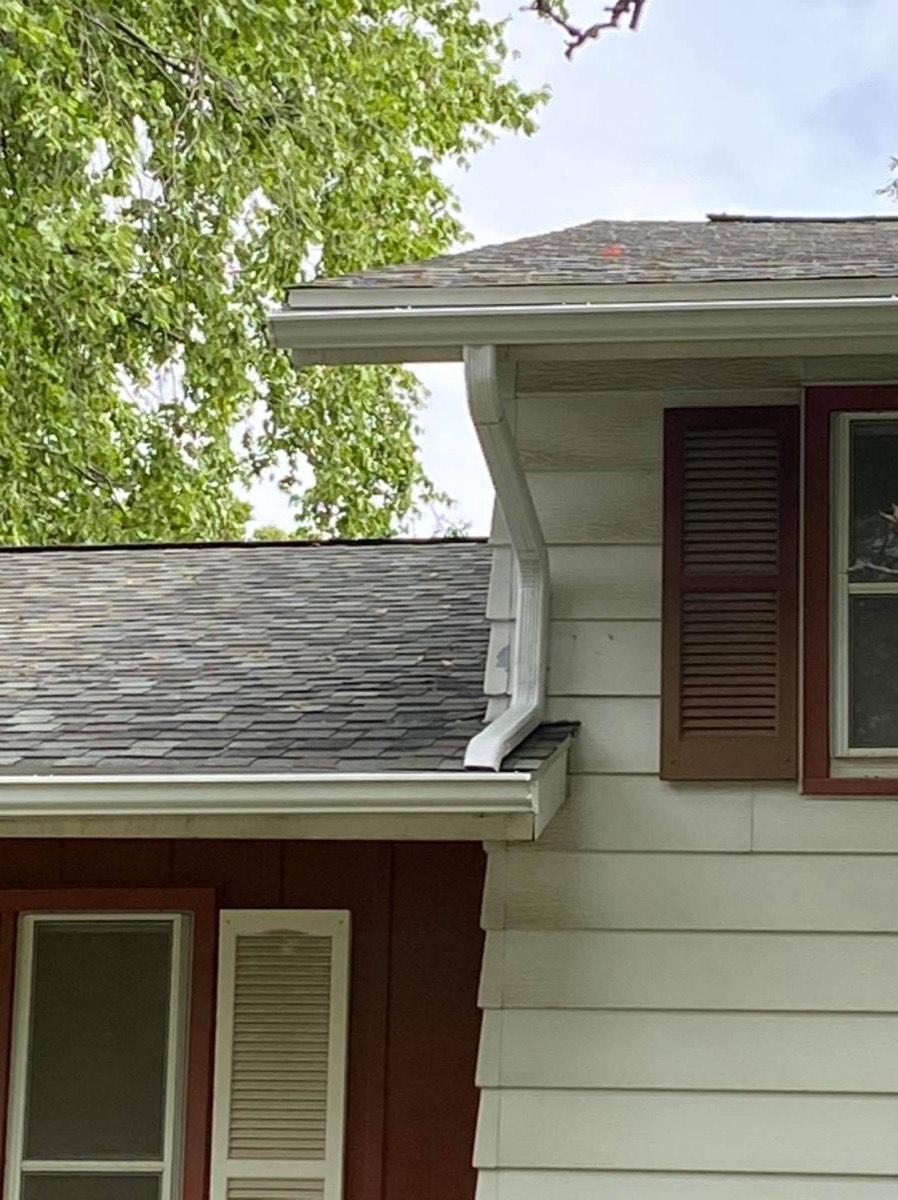 Old worn gutter system before replacement